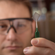 Researcher Brett Savoie with PTEO conductive plastic.